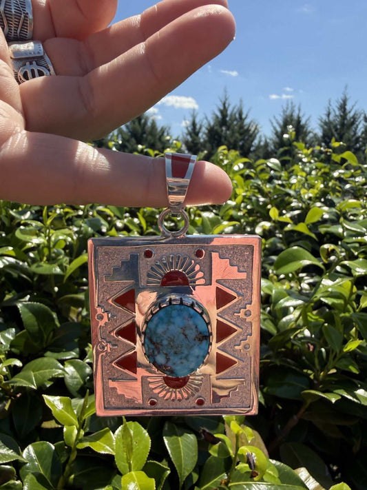 Native American pendant by Navajo artist Michael Perry with Kingman webbed and inlaid Coral