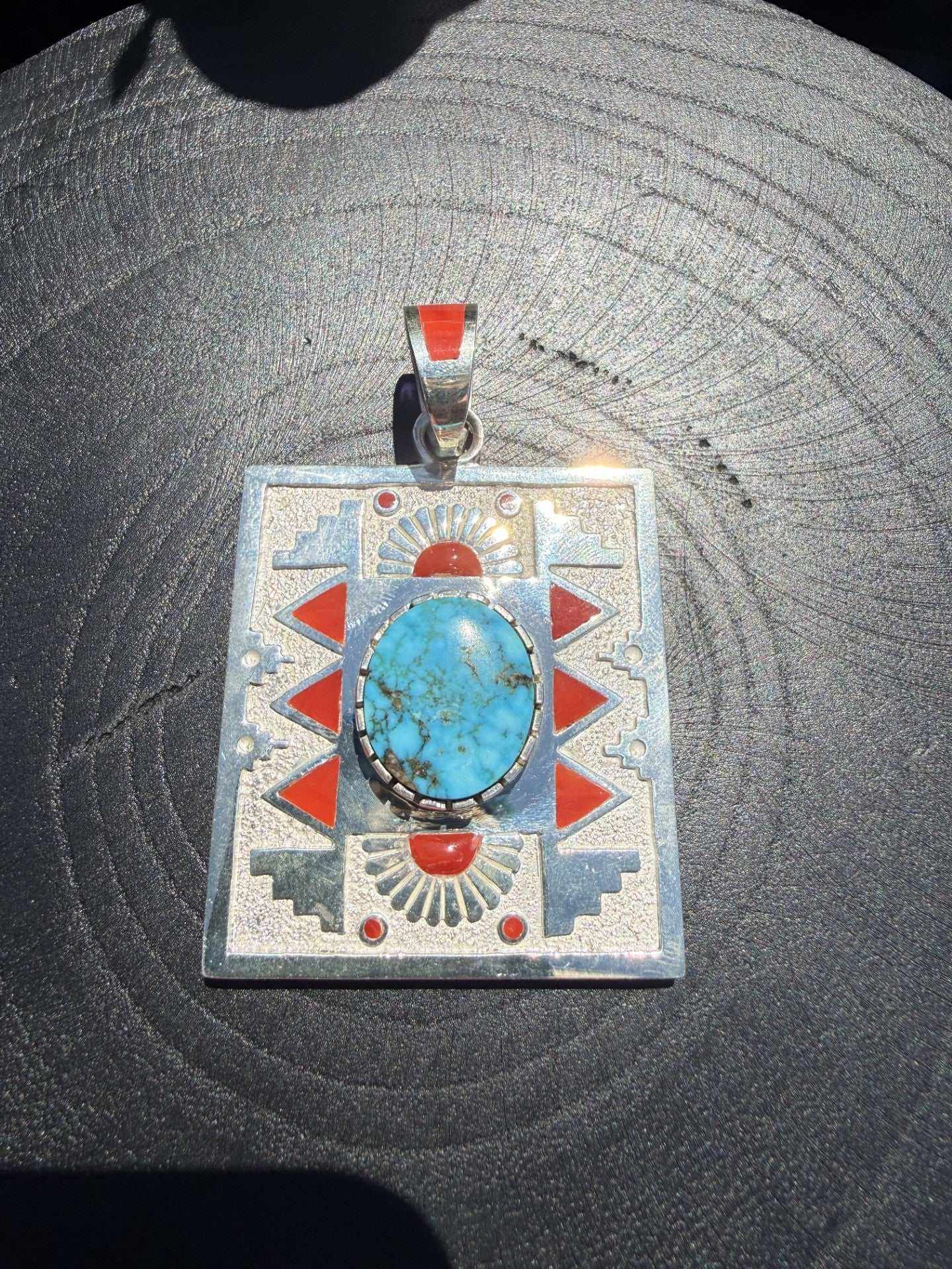 Native American pendant by Navajo artist Michael Perry featuring Kingman turquoise and coral inlay