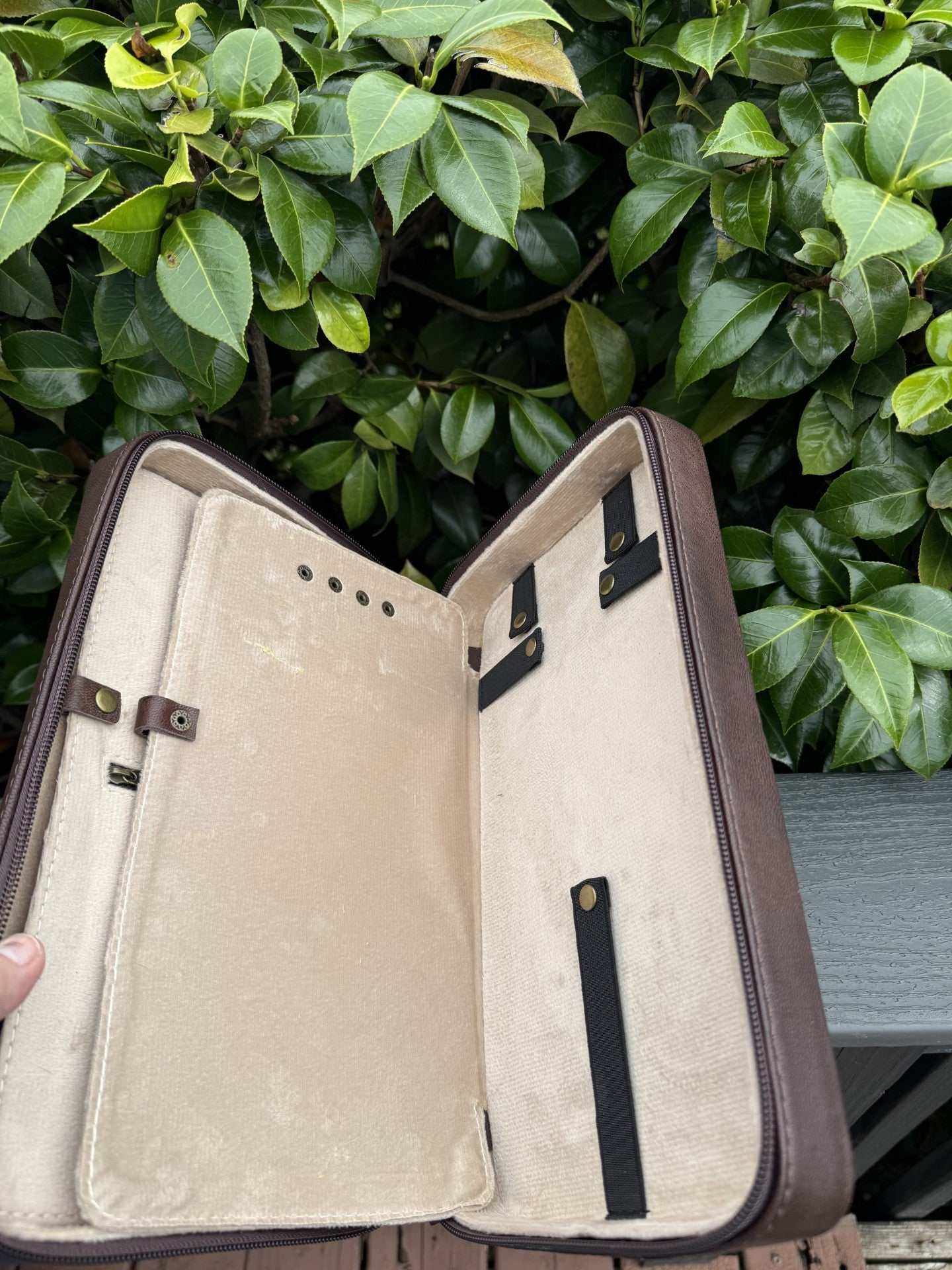 Tooled leather necklace case travel-storage book with three interior sections