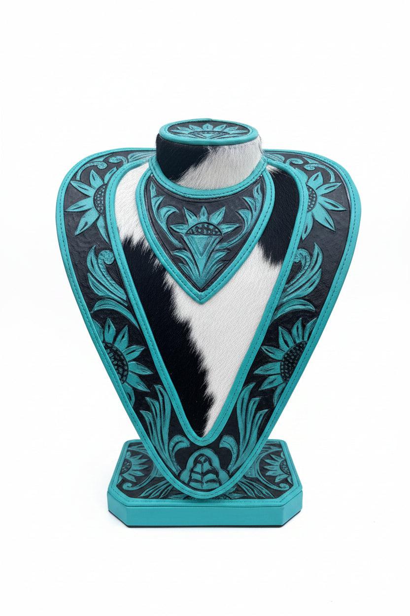 Necklace display with hand tooled green turquoise and black leather with cowhide accents