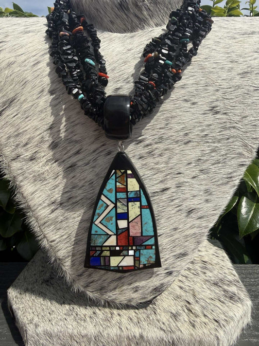 Six Strand Black Jet Necklace with multistone inlay pendant by Chris Nieto featuring turquoise, coral, and spiny stones