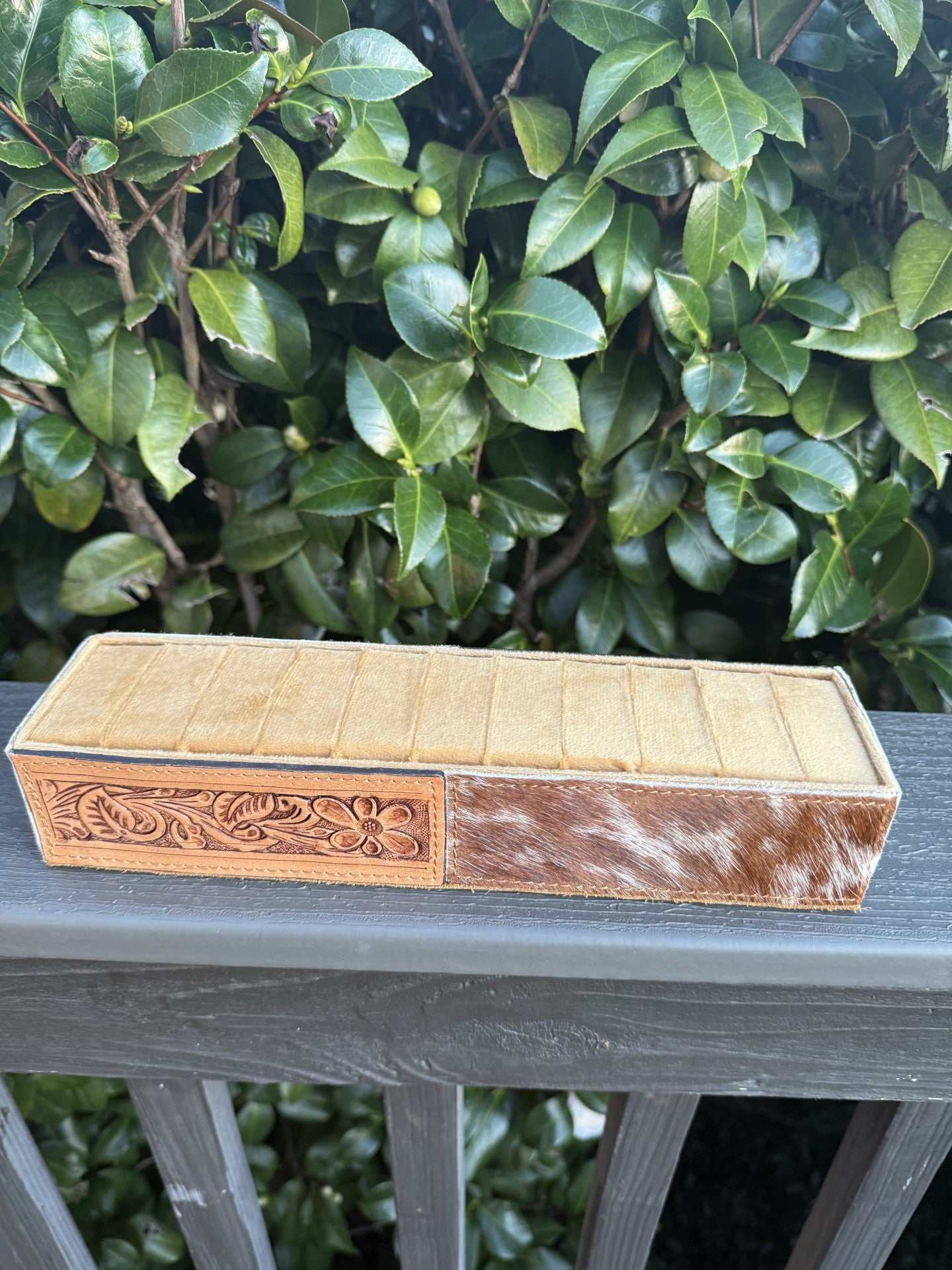 Cowhide and tooled leather ring holder with floral design and rustic charm