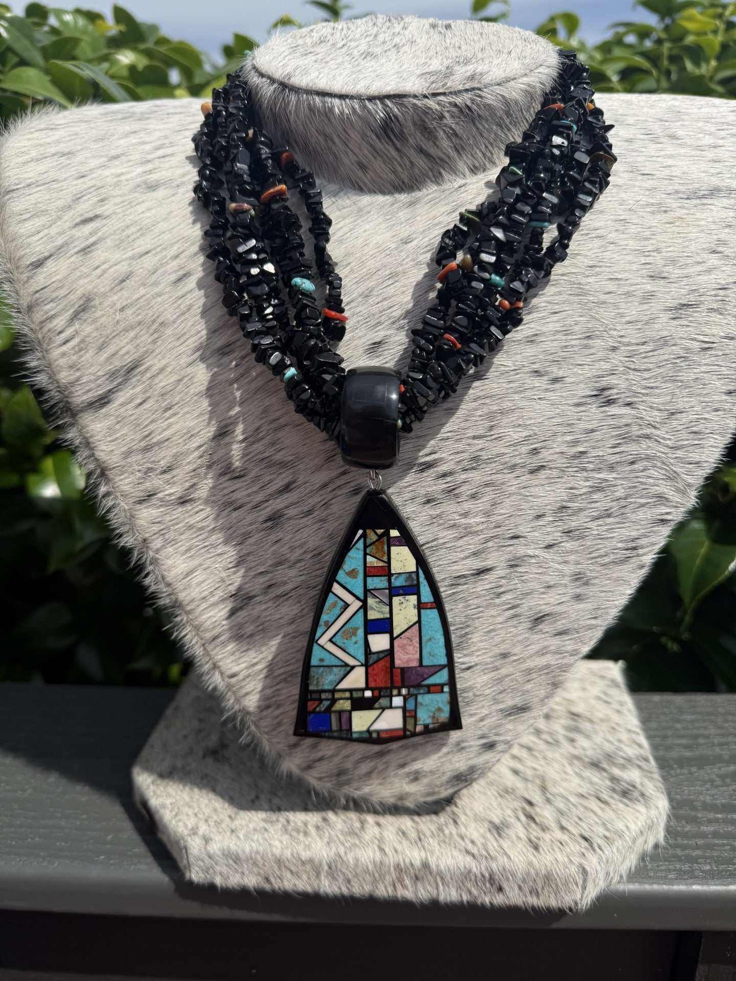 Six strand black jet necklace with multistone inlay pendant by Chris Nieto
