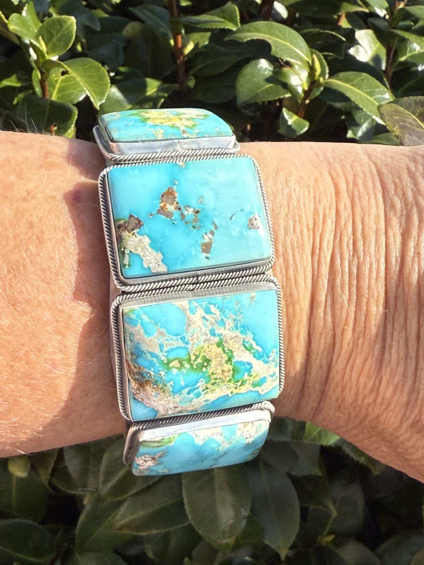 Stunning Sonoran Gold Turquoise cuff with sky-blue stones on wrist