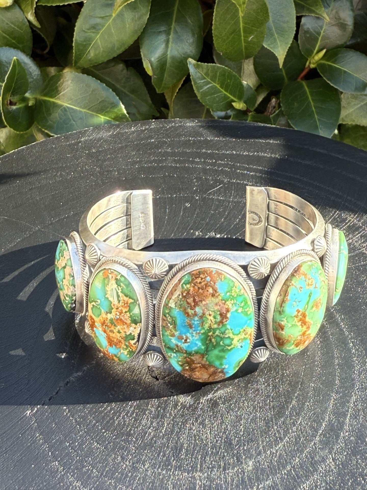 Gorgeous Sonoran Gold Turquoise Cuff with vibrant green blue and gold stones handcrafted by Navajo artisan